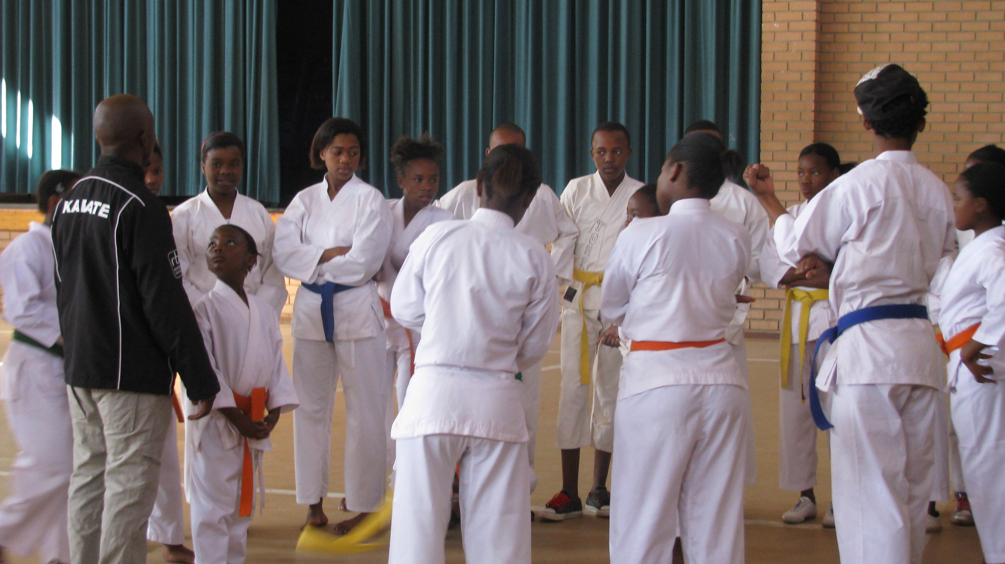Instructors wish their karatekas luck
